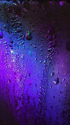 rain drops on the window with purple and blue colors