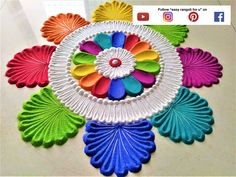 an image of colorful paper flowers on the floor