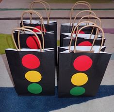 small black shopping bags with red, yellow and green traffic lights on them