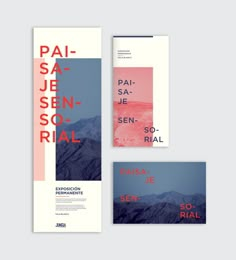 three posters with mountains in the background, one is red and the other is blue