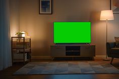 a living room with a green screen tv