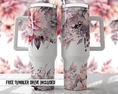 two white coffee mugs with floral designs on them and the words free tumbler drive included