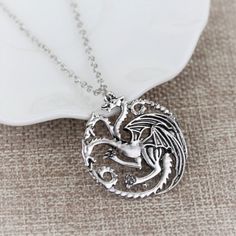 Material: alloy Chain: 26inches ( no clasp) Pendant size: 3.5cm x3cm Come with a gift box Reg: $45 Daenerys Targaryen Necklace, Daenerys Targaryen Dragon Necklace, Daenerys Targaryen Dragons, House Velaryon, Game Of Thrones Necklace, Game Of Thrones Daenerys Targaryen, Badge Necklace, Game Of Thrones Daenerys, Game Of Thrones Jewelry