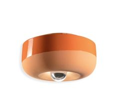 an orange ceiling light on a white background