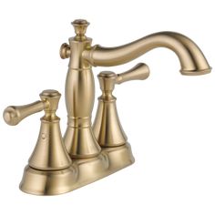 an antique brass faucet with two handles