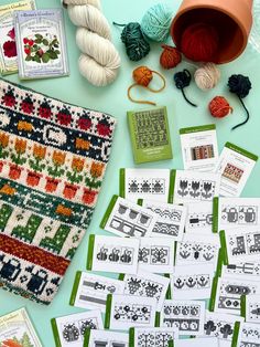 some knitting supplies are laid out on a table