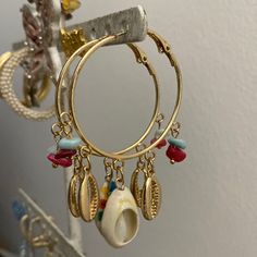 Gold Hoop Earrings With Hand Painted Charms There’s No Ignoring This Statement Piece! Pink And Blue Accents Shell Charms Earrings With Charms, Treasure Chest, Blue Accents, Gold Hoop, Gold Hoop Earrings, Charm Earrings, Blue Gold, Charm Necklace, Shells