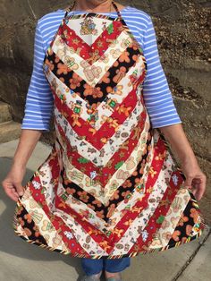 the woman is wearing an apron made out of different fabrics and fabric material, with her hands in her pockets