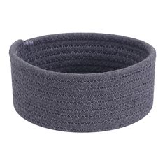 the grey basket is made out of woven fabric and has a round shape on top