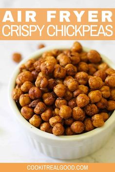 a white bowl filled with crispy chickpeas on top of a marble counter