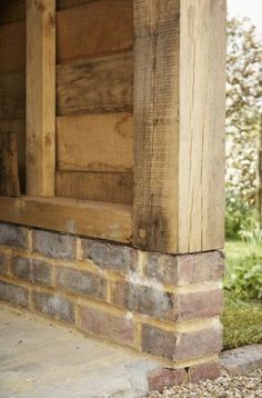 a close up of the corner of a wooden porch