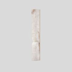 a white marble column with gold trim