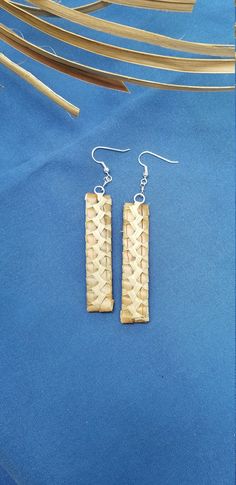 Lauhala earrings, handwoven here on Maui. We collect the leaves of the pandanas tree, clean and prepare them for weaving, all by hand Each item woven is unique and one of a kind, due to the natural color of the leaves. These earrings are about 2 1/2 inches long and are on sterling silver earwires.  The earrings in the photo have been sold, but you will receive a similar pair.  Colors will vary depending on the leaves we have. Earrings will come to you wrapped in tissue in an organza bag, or in a gift box if your prefer. Just let us know is you would like a box . We ship in a box by priority mail Traditional Weaving Jewelry As A Gift, Traditional Natural Jewelry For Gifts, Traditional Natural Jewelry As A Gift, Artisan Handwoven Rectangular Jewelry, Handmade Traditional Rectangular Earrings, Traditional Handmade Rectangular Earrings, Brown Handwoven Earrings For Gift, Bohemian Handwoven Rectangular Jewelry, Artisan Woven Dangle Earrings