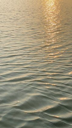 the sun is shining on the water and it looks like ripples