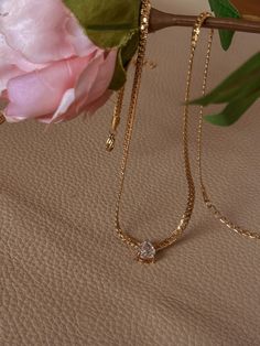 Check out this gorgeous necklace--it's giving pure elegance. This 18K gold-plated waterdrop pendant is seriously dreamy, with a sparkling zircon droplet that adds just the right amount of luxury to any look. The chain is 40cm long with an extra 5cm extender, so it sits beautifully whether you're dressing up or down. Made from stainless steel, it's waterproof and tarnish-free, so it'll keep that shine no matter what. Perfect for adding a touch of glam to your day, this one's all about effortless Luxury Tarnish Resistant Diamond Necklace Gift, Luxury Gold Plated Diamond Necklace Tarnish Resistant, Luxury Gold Plated Tarnish Resistant Diamond Necklace, Droplet Necklace, Sparkly Necklace, Pure Elegance, Necklace Elegant, Elegant Necklace, Elegant Necklaces