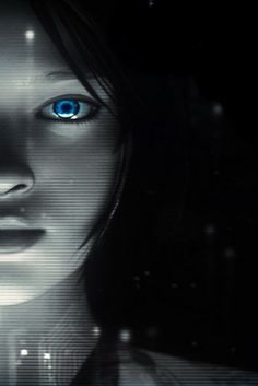 a woman's face with blue eyes in the dark