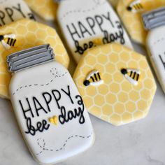 decorated cookies that say happy bee day and honeycombs with the words happy bee days written on them