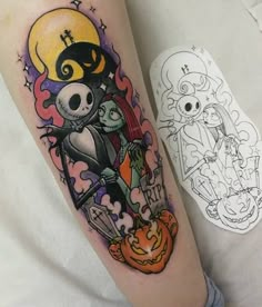 a person with a tattoo on their arm holding a jack - o'- lantern