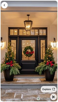 the front door is decorated with christmas wreaths and poinsettias