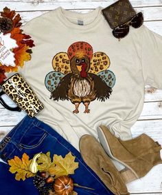 Gobble til you Wobble and add a little fun to your Thanksgiving activities with our Turkey with Leopard Feathers graphic tee shirt! This tee is offered in short or long sleeve options. Makes the perfect Thanksgiving graphic tee! Funny Thanksgiving Shirts Zazzle, Cute Pre-shrunk Shirt For Fall, Multicolor Crew Neck Shirt For Fall, Cute Multicolor Tops For Fall, Fall Funny Print Short Sleeve Tops, Funny Print Short Sleeve Tops For Fall, Fun White T-shirt For Fall, Fall Cotton Graphic Tee Shirt, Cute Multicolor Fall T-shirt