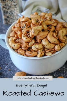 roasted cashews in a white bowl with text overlay that reads everything bagel roasted cashews