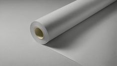 a roll of white paper sitting on top of a table