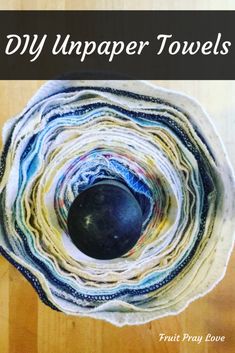 a close up of a bowl on a table with text overlay that reads diy unapper towels