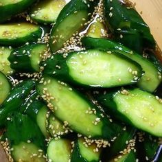 cucumber slices with sesame seeds in a bowl