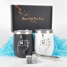 two stainless steel tumblers with the words best gift for you printed on them next to a pair of ice cubes