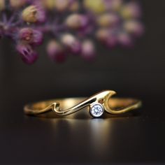 "A perfect gift for an ocean lover, this gorgeous yet simple wave ring is crafted in 14k gold. It has 2 crests giving it a natural wave effect. * Diamond Wt. : 0.02 Cts * Color-Clarity Grade : H-I, Vs-Si * Gold - 14kt, 1.2 gms solid gold If you like this ring, please press \"Pin it\" button on the right of your screen. Find us on Instagram for exquisite designs: @abhikajewels Like us on Facebook: www.facebook.com/Abhikajewels Thank you for visiting our shop.. :D <3" Ocean Wave Ring, Diamond Wave Ring, Wave Diamond Ring, Wave Wedding Ring, Ocean Themed Engagement Rings, Ocean Inspired Ring, Ocean Wedding Ring, Ocean Engagement Ring, Wave Rings