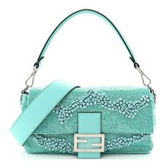 This is an authentic FENDI Rolling Stone Vitello Seta Bead Embroidered Baguette Spring in Turquoise. This stylish baguette is crafted of embellished beads and crystals with matching leather trim. The bag features a looping leather handle, an optional shoulder strap, and silver hardware with a matching FF logo. This opens to a orange satin interior with a zipper pocket. Dream Purse, Pokemon Fabric, Fendi Baguette Bag, Turquoise Bag, Luxe Handbags, Fendi Shoulder Bag, Dream Bags, Wishlist 2024, Fendi Bag