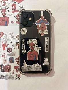 an iphone case with spiderman stickers on it