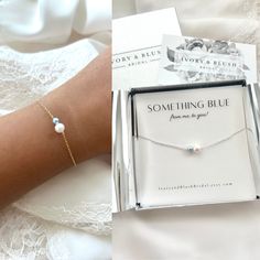 a woman's arm with a bracelet and some other items in the box next to it