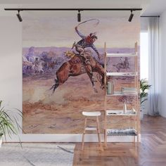 a painting of a cowboy riding a bucking bronco wall mural