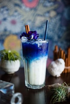 a blue and white drink sitting on top of a table