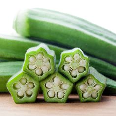 cucumbers are arranged on a wooden surface