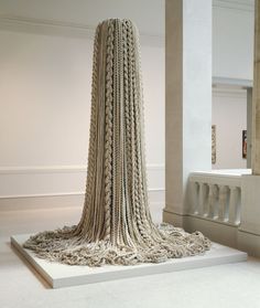 a sculpture is shown in the middle of a room with white walls and flooring