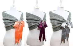 three different types of scarves on mannequins with ribbons attached to them