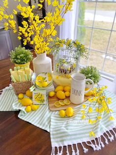 a table topped with lemons and other foods