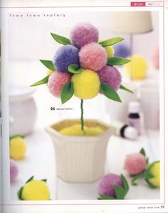 an image of a flower in a pot on the cover of a magazine or brochure