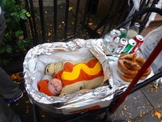 a hot dog with mustard and ketchup in a cart