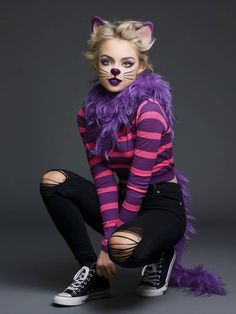 a woman in a cat costume posing for the camera