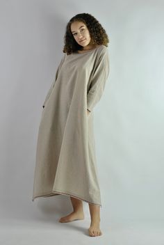 This is our no. 52 of Conscious Clothing Concept. This beautiful beige A-line loose fitting kaftan dress is made of pure quality linen. It is very comfortable to wear around the house or as the night dress. It works well as the summer beach dress protecting from the sun. It has got two pockets on the sides. Top and the bottom of the dress is machine embroided. It is the ultimate fabric for hot weather as it breathes and absorbs moisture better that any fabric on earth. Please write if you need d Beach Dresses With Pockets In Khaki, Khaki Beach Dresses With Pockets, Beige Kaftan For Spring Daywear, Bohemian Linen Loungewear Dresses, Beige Dresses For Loungewear, Beige Tunic Dress For Loungewear, Oversized Cream Dress For Daywear, Beige Cotton Kaftan For Spring, Spring Beige Cotton Kaftan