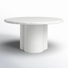 a white round table on a grey background