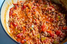 a pot filled with meat and vegetables on top of a stove