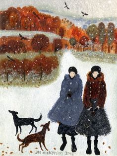 two women walking their dogs in the snow