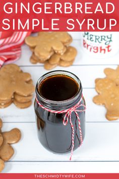 homemade gingerbread simple syrup recipe in a mason jar with cookies and candy canes around it