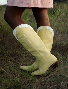 The Carrie, our stunning light yellow women's cowboy boots with striking stars stitched down the sides. The soft yellow color is sure to add a burst of energy into your outfit. Designed and crafted with meticulous attention to detail and high-quality materials, these boots ensure both durability and style. Whether you're dressing up for a special occasion or adding a touch of flair to your everyday look, The Carrie will elevate your fashion game and is sure to become a center piece of your wardr Yellow Boots Aesthetic, Yellow Cowgirl Boots, Yellow Western Boots With Round Toe, Yellow Knee High Boots, Yellow Boots, Cowboy Boots Women, Pastel Yellow, Boot Accessories, Star Stitch