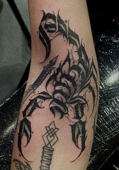 a black and white tattoo design on the leg