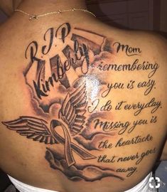 a woman with a tattoo on her back that reads, mom remembrance you're easy